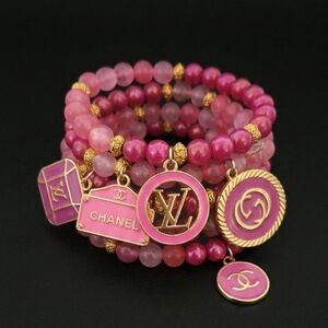 Chanel Pink and Gold Charm Bracelet Set